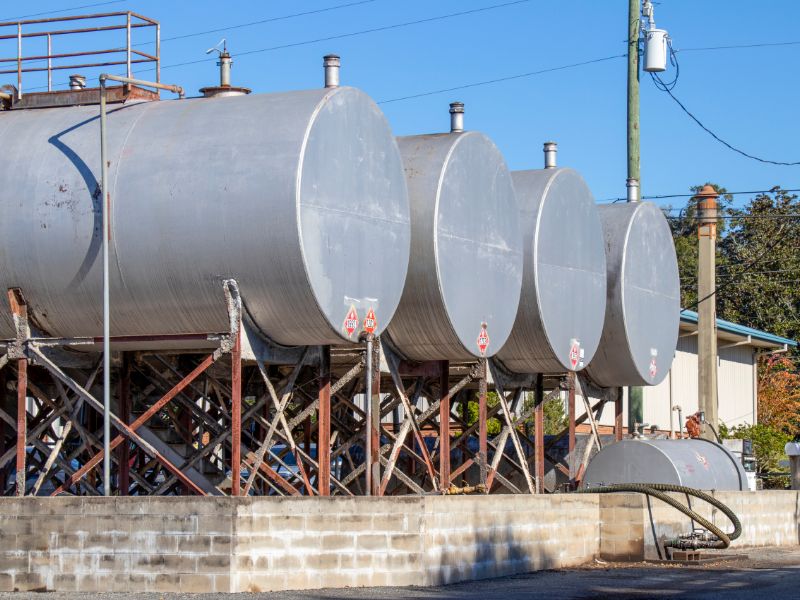 Four Large tanks elevated on a brink platform.