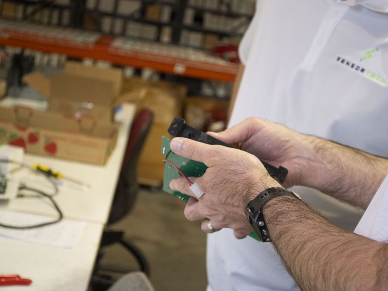 Person holding electrical equipment