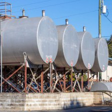 Four Large tanks elevated on a brink platform.